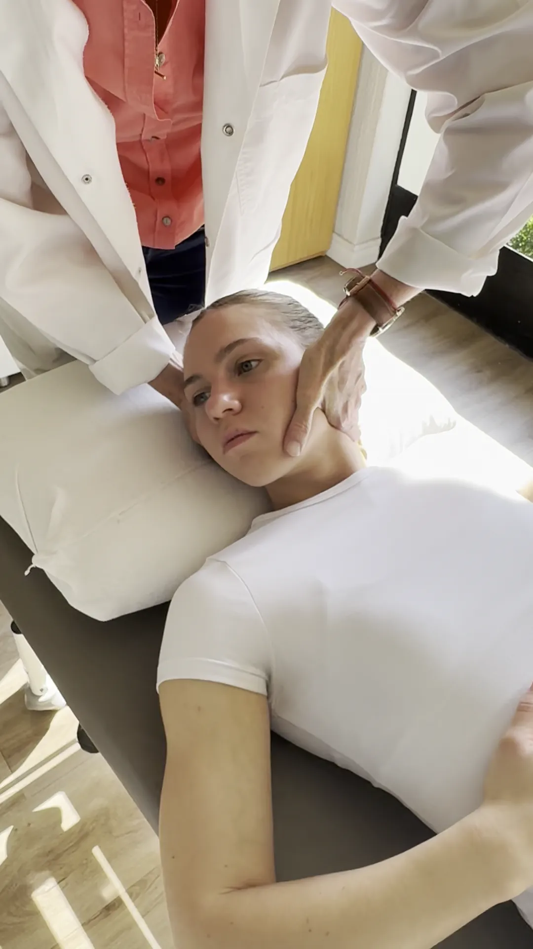 Professional massage therapist providing therapeutic treatment in a serene spa environment