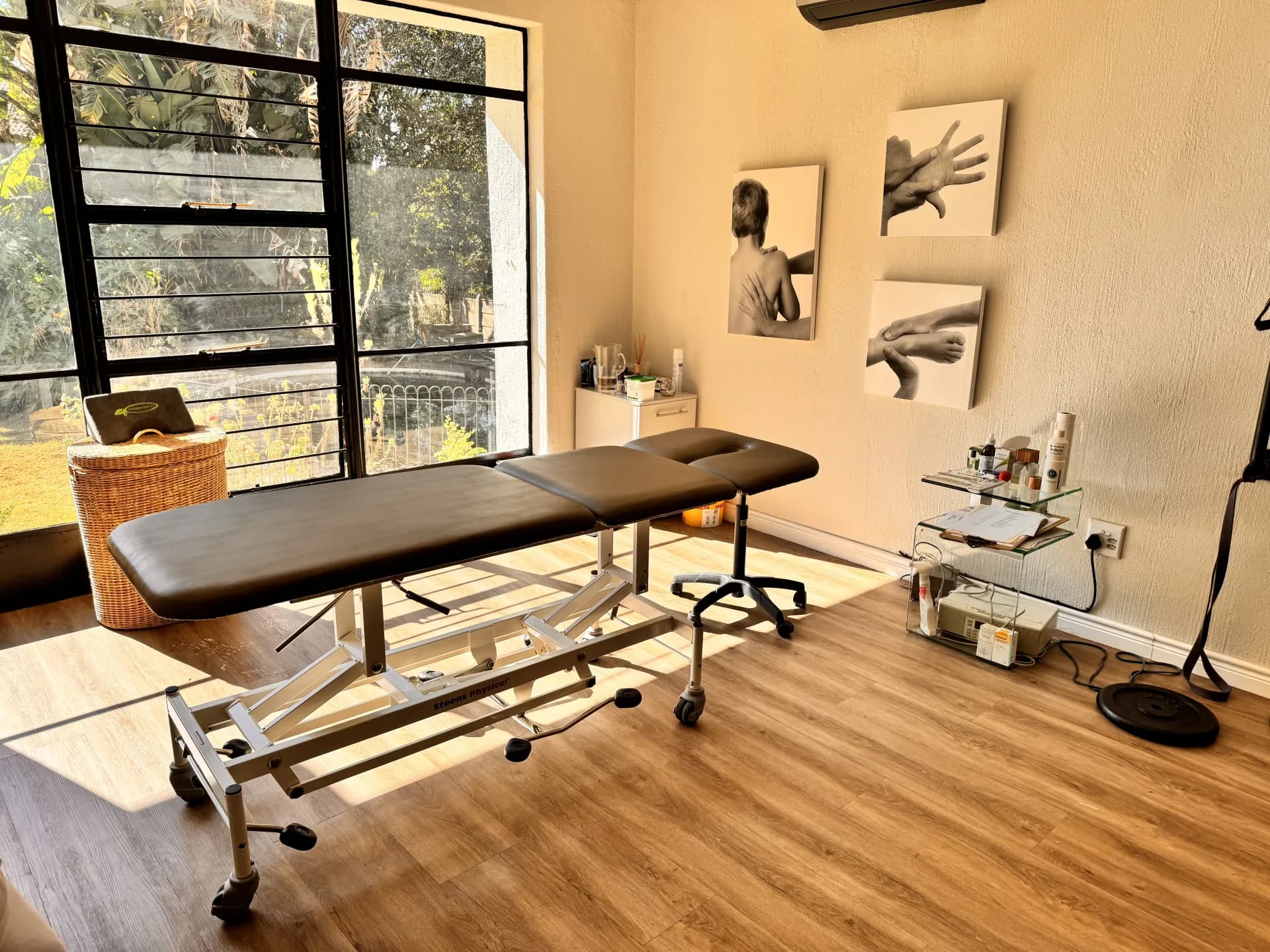 Serene massage therapy room with professional treatment table and calming ambient lighting